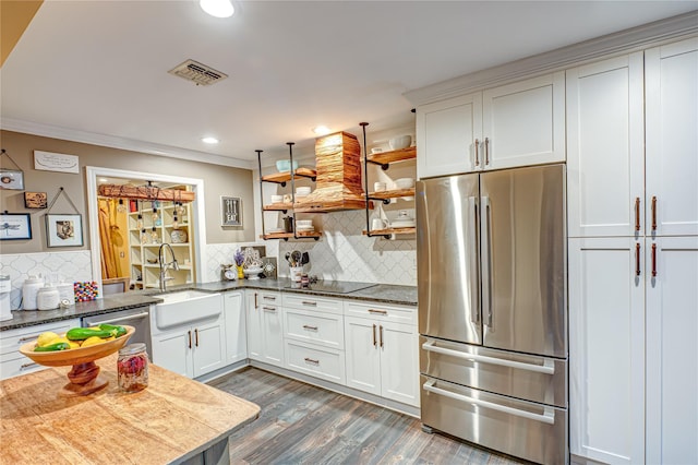 60 Jeremy Cir, Nesconset, NY 11767 - kitchen featuring appliances with stainless steel finishes, open shelves, dark wood-type flooring, recessed lighting, and backsplash
