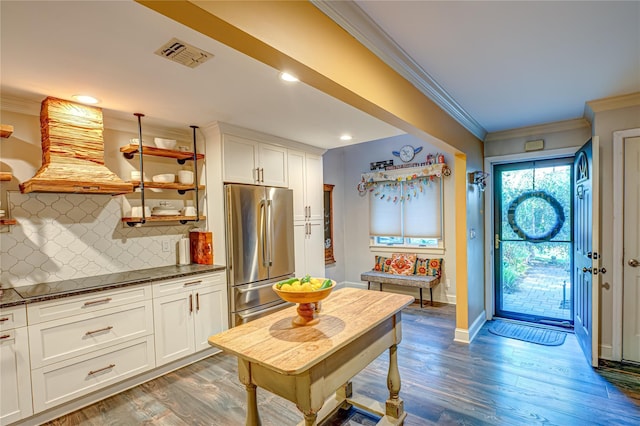 60 Jeremy Cir, Nesconset, NY 11767 - kitchen with stainless steel fridge, open shelves, custom range hood, crown molding, and tasteful backsplash