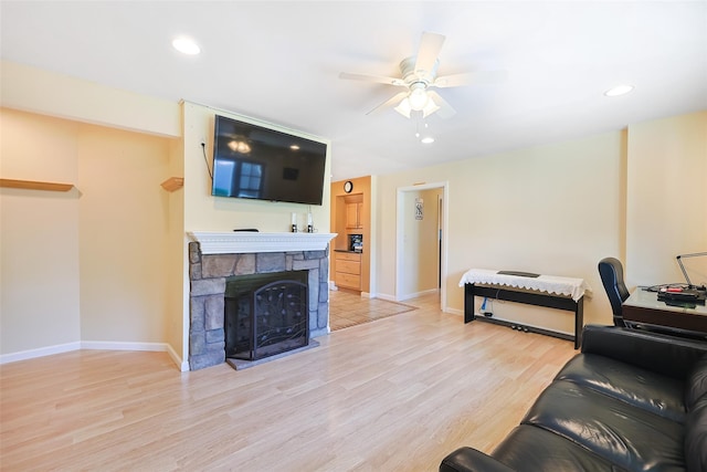 4 Wagon Ln, Levittown, NY 11756 - living area with a ceiling fan, light wood-type flooring, recessed lighting, and a stone fireplace