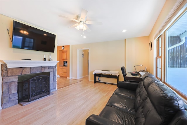 4 Wagon Ln, Levittown, NY 11756 - living room with ceiling fan, light wood-style floors, recessed lighting, and a stone fireplace