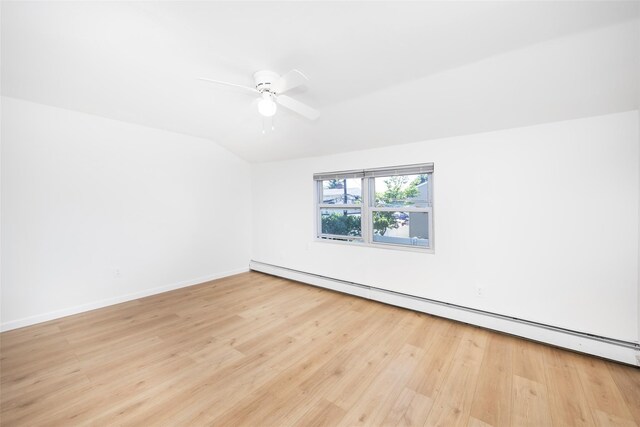 4 Wagon Ln, Levittown, NY 11756 - bonus room featuring a baseboard radiator, lofted ceiling, light wood-style flooring, and a ceiling fan