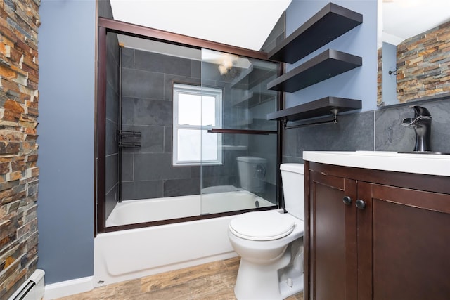 4 Wagon Ln, Levittown, NY 11756 - bathroom with vanity, baseboard heating, and enclosed tub / shower combo
