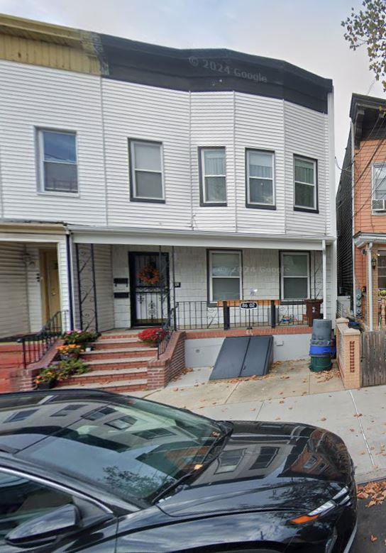 8602 89th St, Woodhaven, NY 11421 - multi unit property featuring a porch