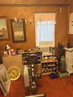 8602 89th St, Woodhaven, NY 11421 - office area with wood walls, cooling unit, and radiator