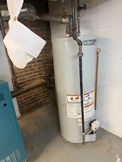 8602 89th St, Woodhaven, NY 11421 - utility room with water heater