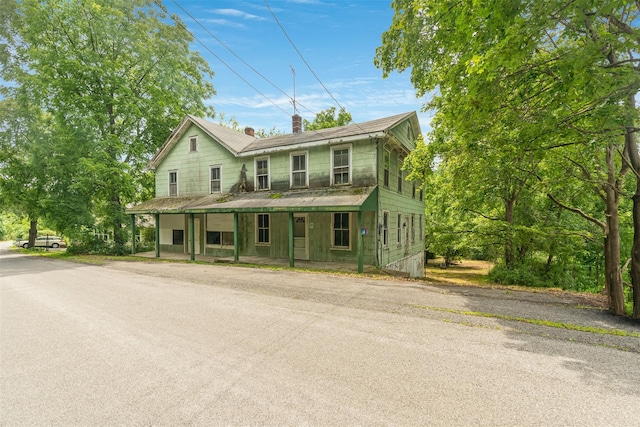 50 Maple St, Catskill, NY 12414 - view of front facade with a chimney and a porch