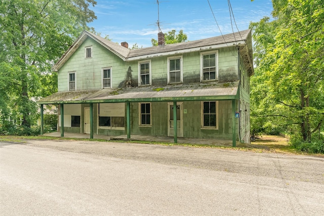 50 Maple St, Catskill, NY 12414 - view of front of property featuring a chimney and a porch