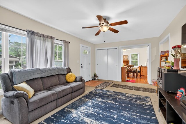 8 First St, Godeffroy, NY 12729 - living room featuring a ceiling fan