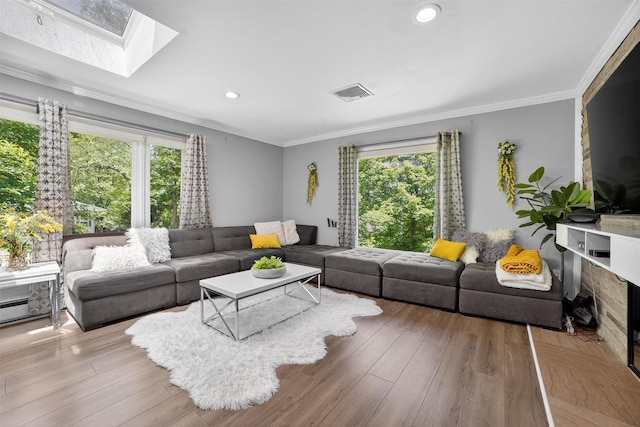 46 Alta Pl, Yonkers, NY 10710 - living room featuring plenty of natural light, crown molding, a skylight, wood finished floors, and recessed lighting