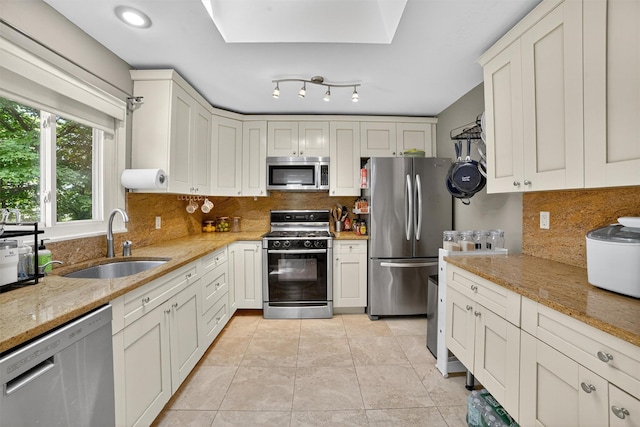 46 Alta Pl, Yonkers, NY 10710 - kitchen featuring appliances with stainless steel finishes, backsplash, and light stone countertops