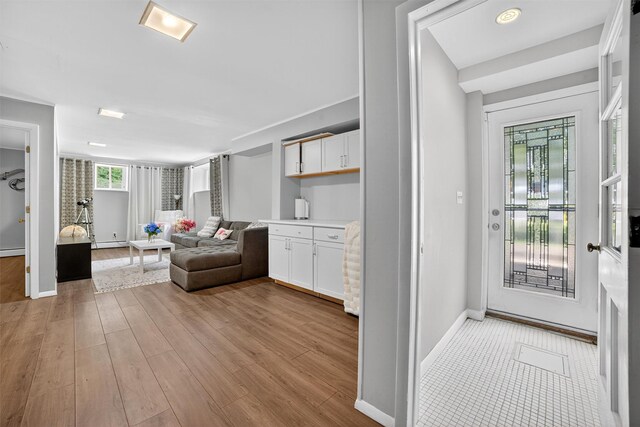 46 Alta Pl, Yonkers, NY 10710 - living area featuring wood finished floors, a baseboard heating unit, and a baseboard radiator