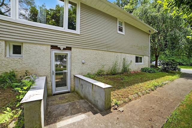 46 Alta Pl, Yonkers, NY 10710 - view of exterior entry featuring stucco siding