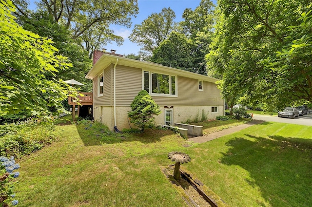 46 Alta Pl, Yonkers, NY 10710 - view of home's exterior with a chimney, a lawn, and a deck