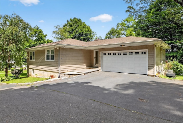 46 Alta Pl, Yonkers, NY 10710 - single story home featuring asphalt driveway and a garage