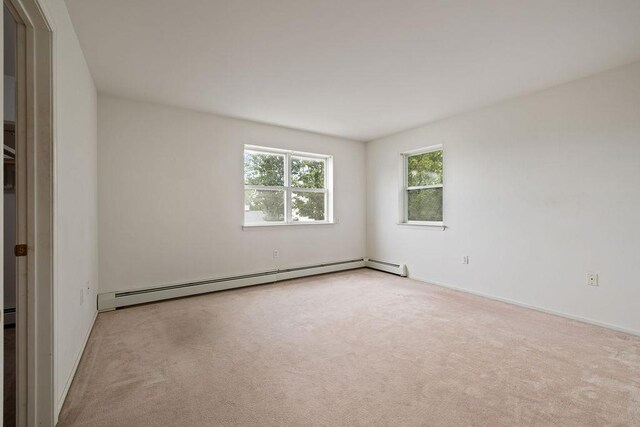 180 Depew Ave, Nyack, NY 10960 - carpeted spare room featuring a baseboard radiator and plenty of natural light