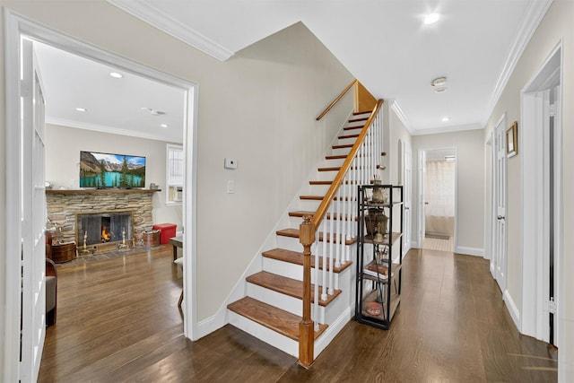 167 Hillview Ave, Yonkers, NY 10704 - stairway with ornamental molding, wood finished floors, a stone fireplace, and recessed lighting