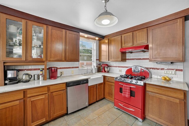 167 Hillview Ave, Yonkers, NY 10704 - kitchen featuring dishwasher, gas stove, backsplash, and under cabinet range hood