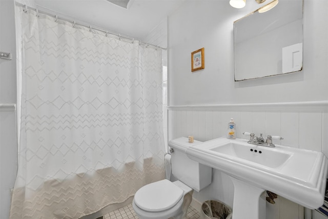 167 Hillview Ave, Yonkers, NY 10704 - bathroom featuring a wainscoted wall and tile patterned floors