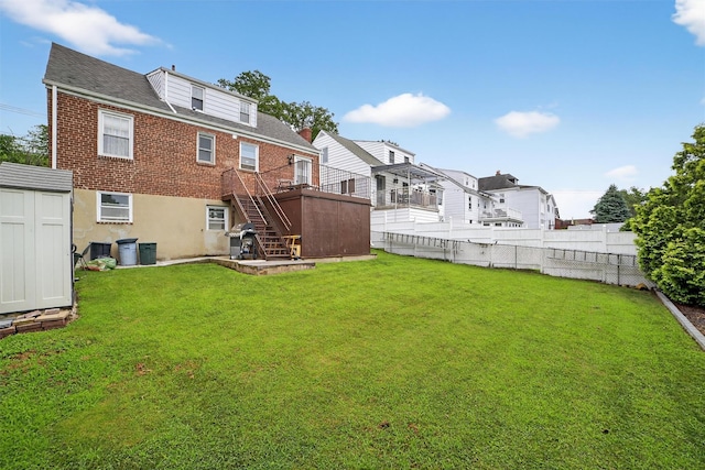 167 Hillview Ave, Yonkers, NY 10704 - rear view of property featuring a shed, stairway, brick siding, and roof with shingles