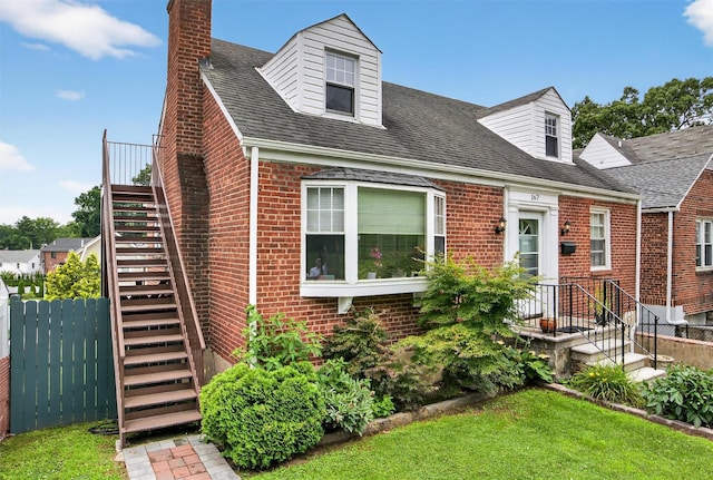 167 Hillview Ave, Yonkers, NY 10704 - cape cod home featuring brick siding, stairs, a chimney, and a shingled roof