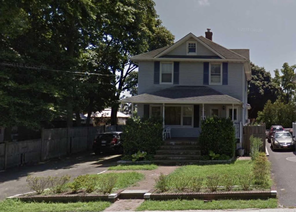 102 Park Ave, Babylon, NY 11702 - american foursquare style home featuring a chimney, asphalt driveway, and covered porch