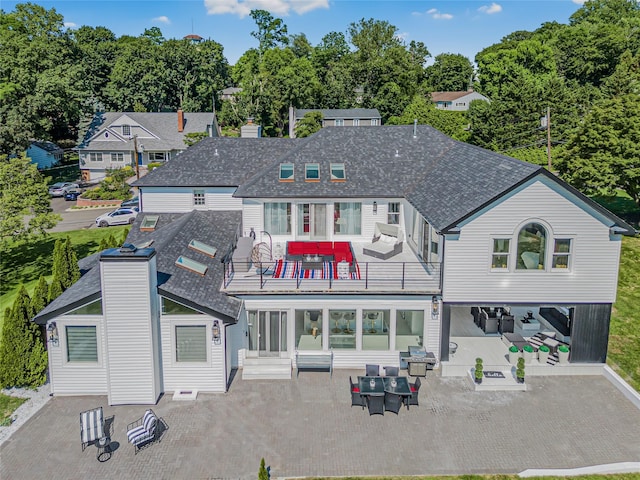 3 Fairview Ln, Glen Cove, NY 11542 - back of house with a patio, an outdoor living space, and a chimney