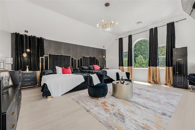 3 Fairview Ln, Glen Cove, NY 11542 - bedroom featuring an accent wall, a chandelier, and vaulted ceiling