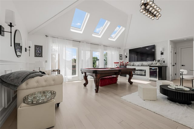 3 Fairview Ln, Glen Cove, NY 11542 - recreation room featuring wine cooler, high vaulted ceiling, a skylight, light wood-style floors, and billiards