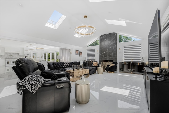 3 Fairview Ln, Glen Cove, NY 11542 - living area with a skylight, vaulted ceiling, marble tiled flooring, and a fireplace