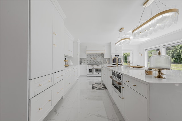 3 Fairview Ln, Glen Cove, NY 11542 - kitchen featuring light marble finish flooring, double oven range, white cabinets, backsplash, and light countertops