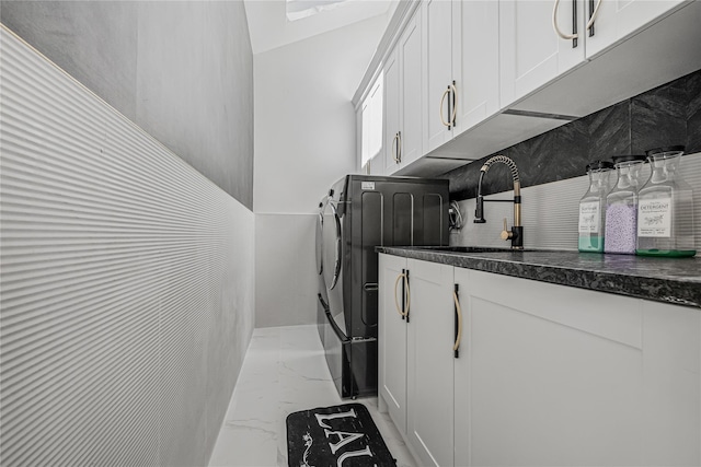 3 Fairview Ln, Glen Cove, NY 11542 - washroom with light marble finish flooring, washing machine and dryer, and cabinet space