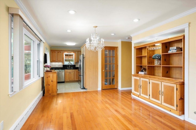 303 Helena Ave, Yonkers, NY 10710 - kitchen featuring stainless steel appliances, a chandelier, ornamental molding, light wood-type flooring, and decorative light fixtures
