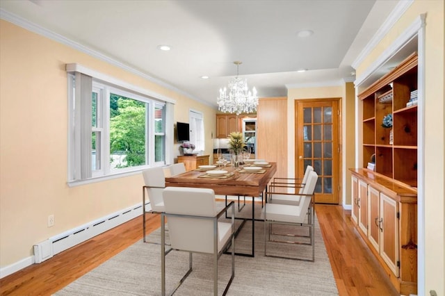 303 Helena Ave, Yonkers, NY 10710 - dining room with a baseboard heating unit, a chandelier, crown molding, light wood finished floors, and recessed lighting