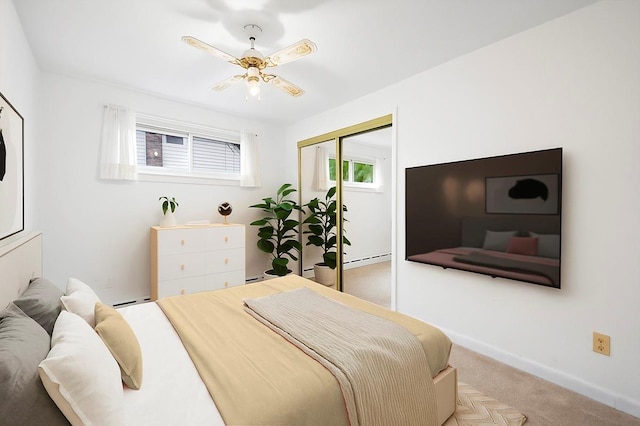303 Helena Ave, Yonkers, NY 10710 - carpeted bedroom featuring a closet, a baseboard radiator, and ceiling fan