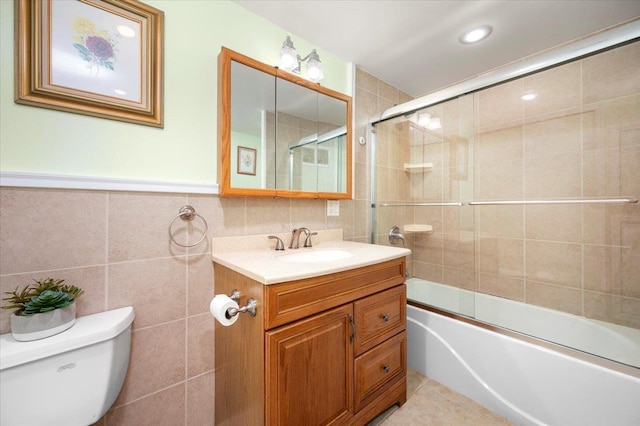 303 Helena Ave, Yonkers, NY 10710 - full bathroom with tile walls, vanity, shower / bath combination with glass door, and recessed lighting