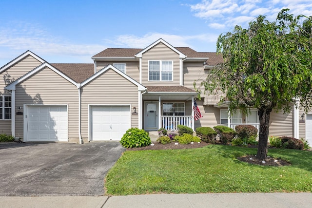 48 Sparrow Ridge Rd, Carmel, NY 10512 - view of front of property featuring driveway, an attached garage, a front yard, a porch, and a shingled roof