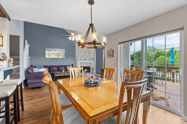 48 Sparrow Ridge Rd, Carmel, NY 10512 - dining space with light wood finished floors, a premium fireplace, and a chandelier