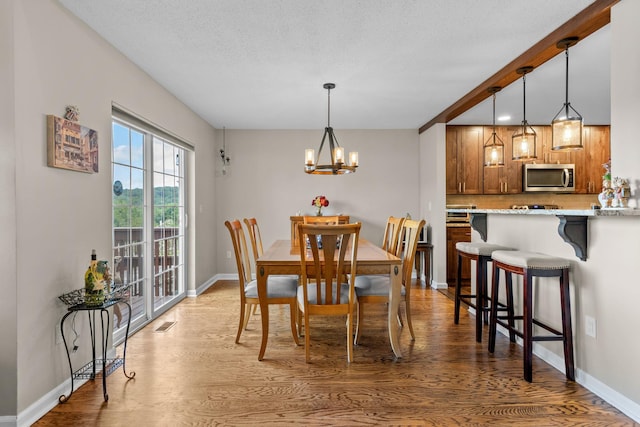 48 Sparrow Ridge Rd, Carmel, NY 10512 - dining area featuring light wood-style floors and a chandelier