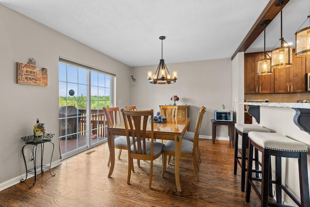 48 Sparrow Ridge Rd, Carmel, NY 10512 - dining space featuring dark wood-style flooring, a chandelier, and a textured ceiling