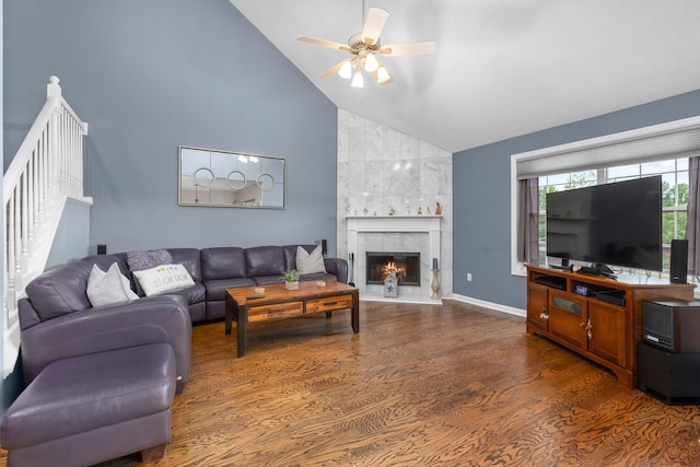 48 Sparrow Ridge Rd, Carmel, NY 10512 - living area featuring wood finished floors, a ceiling fan, stairway, a tile fireplace, and high vaulted ceiling