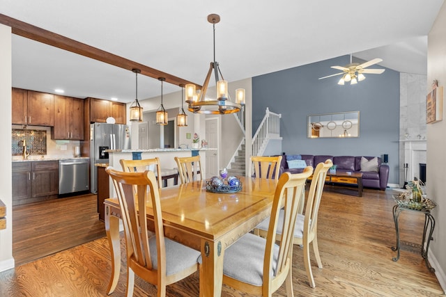 48 Sparrow Ridge Rd, Carmel, NY 10512 - dining room with light wood-style floors, stairway, a ceiling fan, recessed lighting, and a chandelier