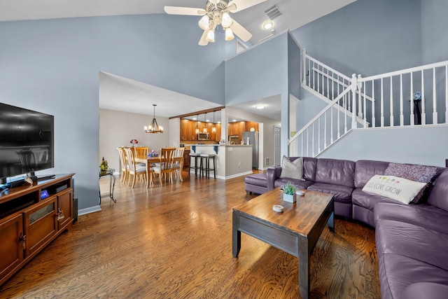 48 Sparrow Ridge Rd, Carmel, NY 10512 - living room featuring a ceiling fan, a chandelier, stairway, a towering ceiling, and wood finished floors