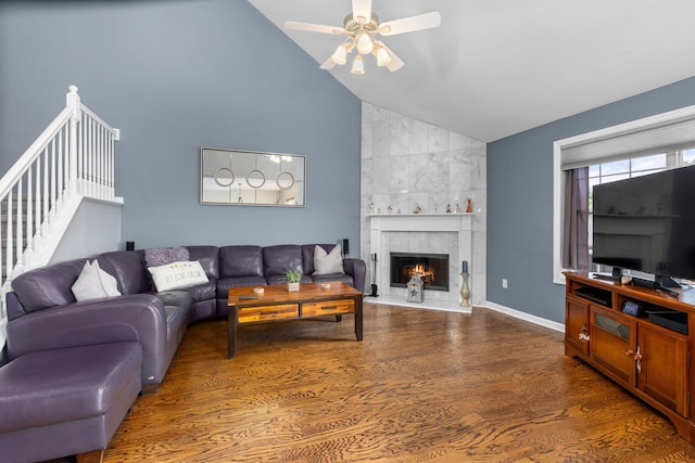 48 Sparrow Ridge Rd, Carmel, NY 10512 - living area with lofted ceiling, a ceiling fan, wood finished floors, a tile fireplace, and stairway