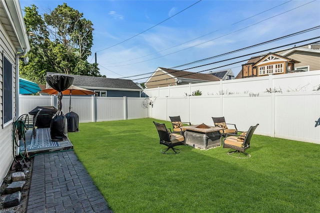 18 Seawane Rd, East Rockaway, NY 11518 - fenced backyard with a fire pit