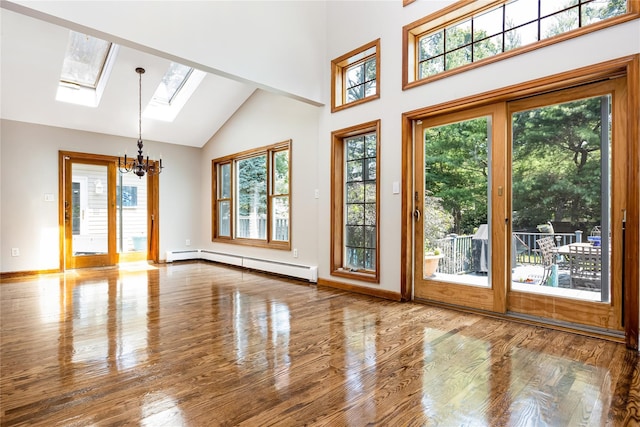 45 Mc Cue Ln, Babylon, NY 11702 - doorway to outside with baseboard heating, a chandelier, a skylight, high vaulted ceiling, and wood finished floors