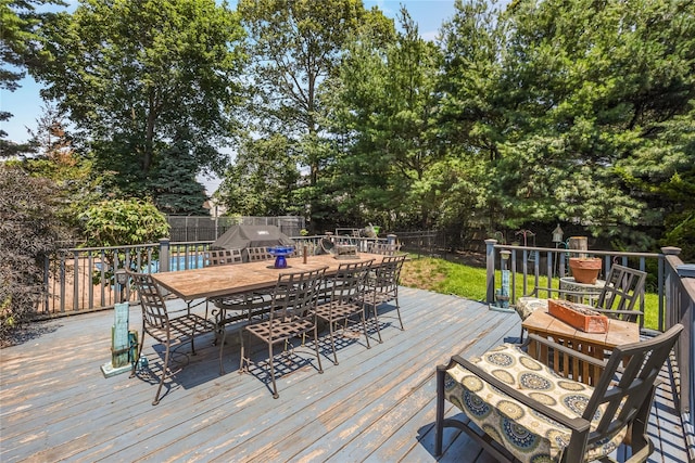 45 Mc Cue Ln, Babylon, NY 11702 - deck with a fenced backyard, outdoor dining area, and view of scattered trees