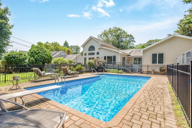 45 Mc Cue Ln, Babylon, NY 11702 - view of swimming pool featuring a patio area and a diving board