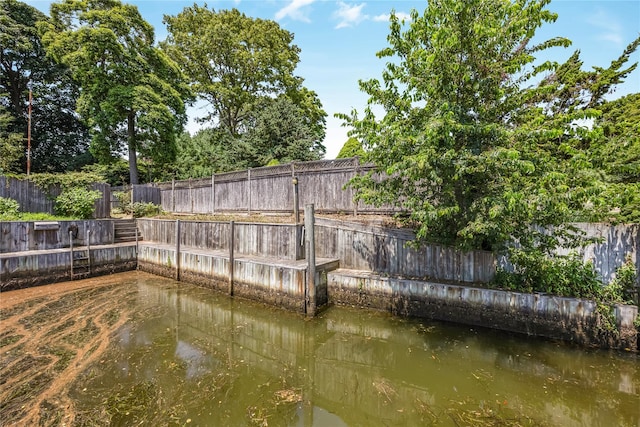 45 Mc Cue Ln, Babylon, NY 11702 - dock featuring a fenced backyard