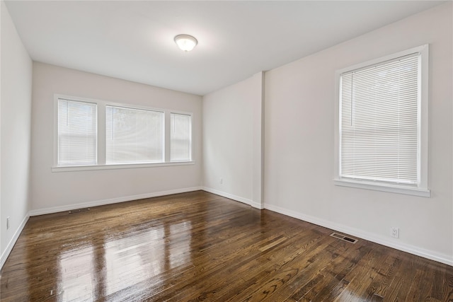 401 Ocean Ave, Malverne, NY 11565 - empty room featuring dark wood-style floors and baseboards