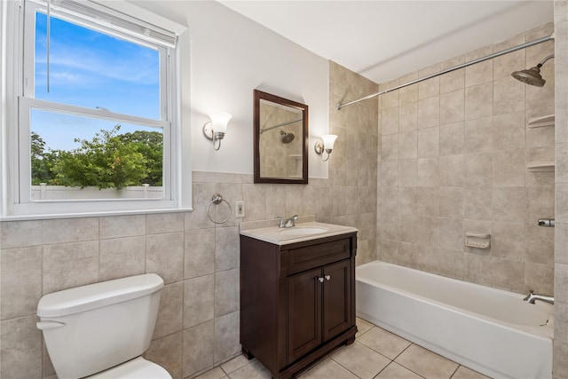 401 Ocean Ave, Malverne, NY 11565 - full bath featuring tile patterned floors, vanity, tile walls, and  shower combination